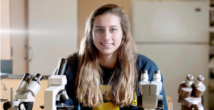 Stephen Haas/The News-GazetteEma Rajic, the News-Gazettes 2017 girls Swimmer of the Year, poses for a photo in a biology lab at Uni High School in Urbana on Friday, Dec. 1, 2017.