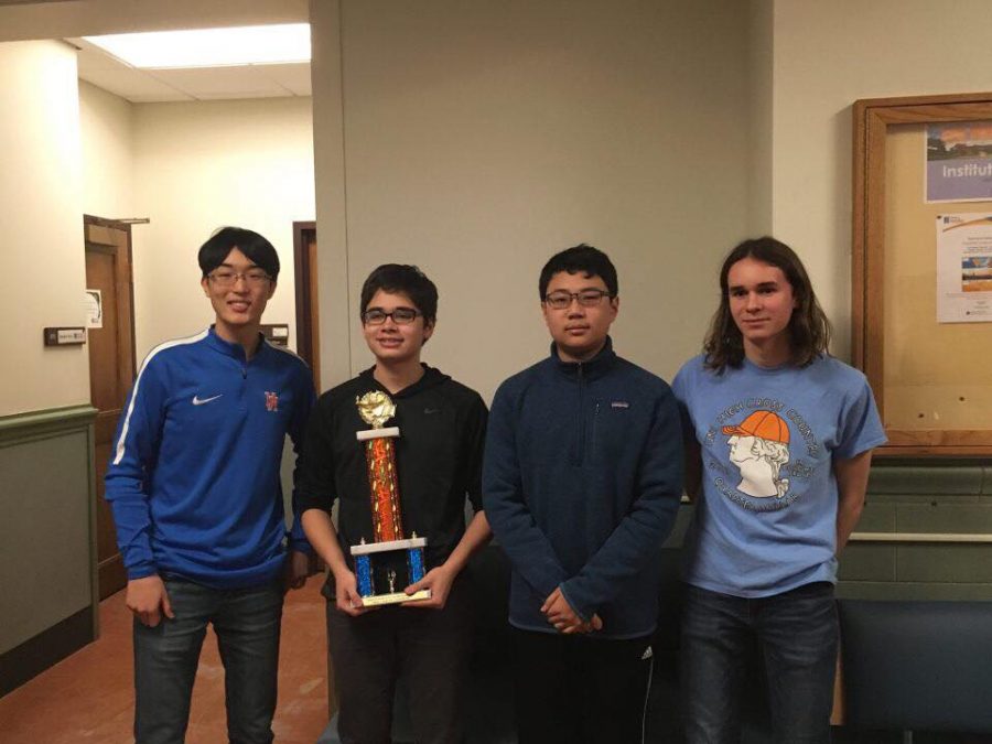 The+Scholastic+Bowl+team+pose+with+their+state+championship+trophy.+%28L-R%29+junior+Tim+Cho%2C+sophomore+Dylan+Bowman%2C+freshman+Jonathan+Lau%2C+and+sophomore+Ethan+Ashbrook.+Photo+courtesy+of+Dylan+Bowman.+