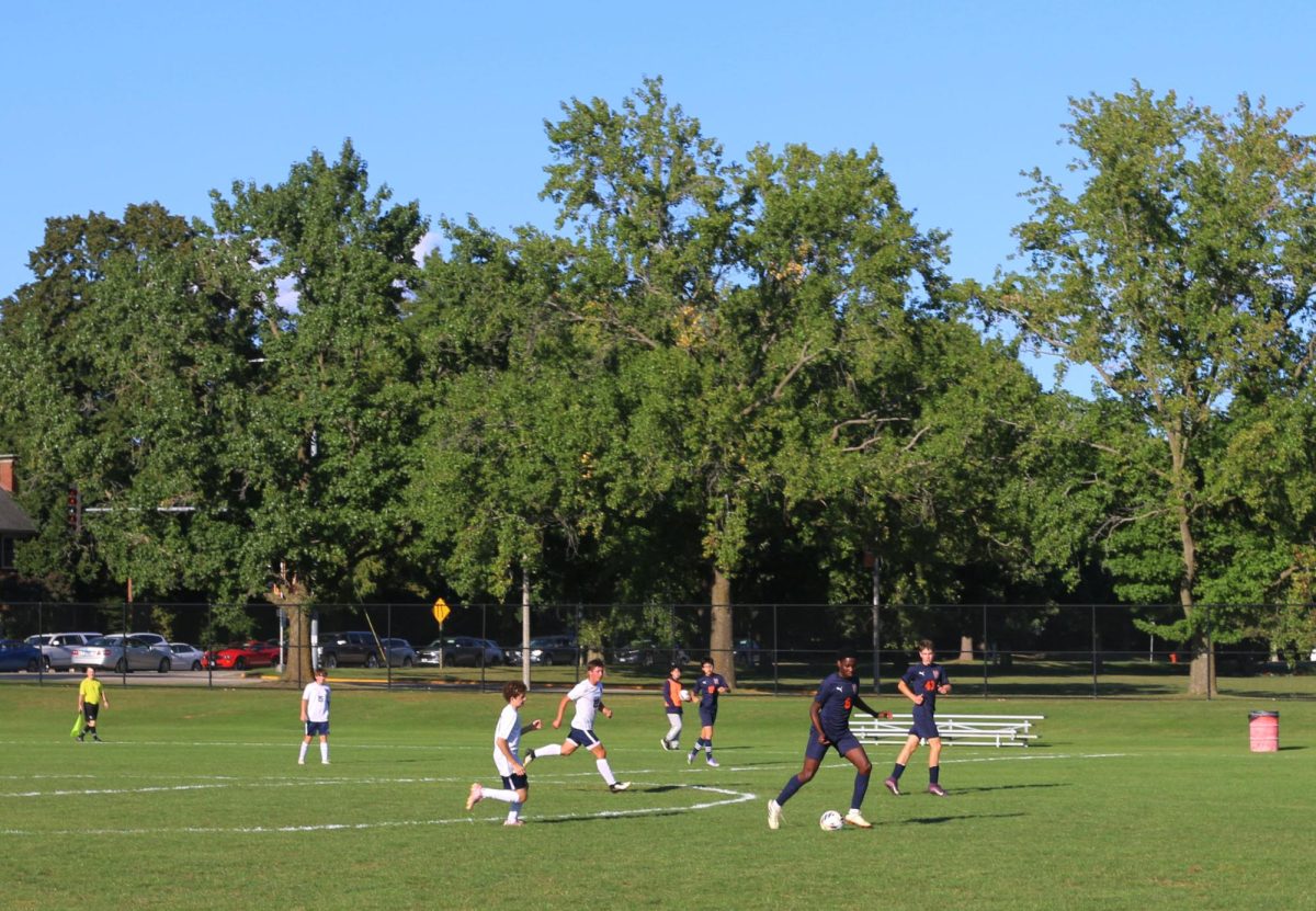 Junior BJ A. dribbles during the Aug. 26 varsity soccer game against Calvary Christian Academy.